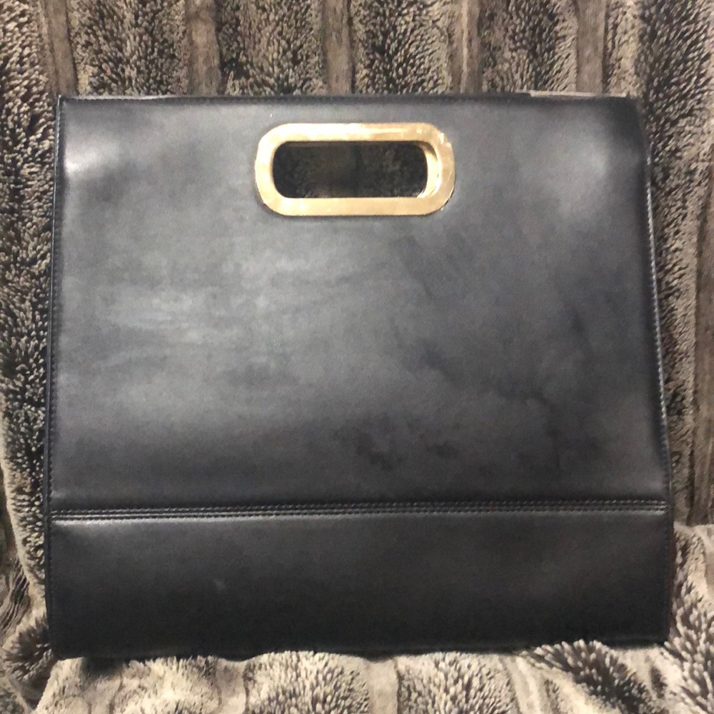Black purse with gold handle